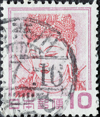 Japan - circa 1951: a postage stamp from Japan, showing a Kannon Bosatsu (Wall Painting) - Kondo...