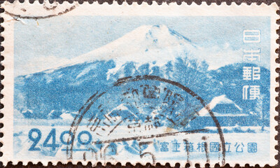 Japan - circa 1949: a postage stamp from Japan , showing Mount Fuji in winter. With Shinobu-no Village