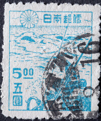 Japan - circa 1947: a postage stamp from Japan, showing Fishing-boats at Sea with Whales. whaling