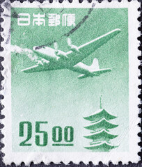 Japan - circa 1951: a postage stamp from Japan, showing a Douglas DC-4 over the Horyu-ji Pagoda,...