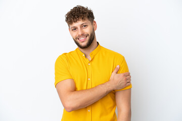 Young handsome caucasian man isolated on white background laughing