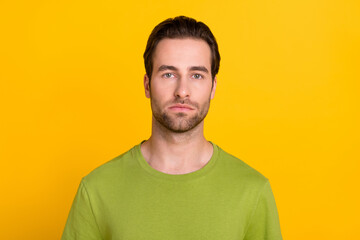 Photo of young man calm peaceful smart wear casual clothes stubble isolated over yellow color...