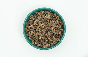 Fototapeta na wymiar Sweet buckwheat seeds on a monochrome background