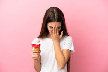 Little girl with a cornet ice cream over isolated pink background with tired and sick expression