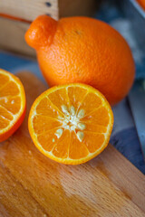 Freshly squeezed mandarin orange juice with glass pitcher, glass jars and aluminum reusable straws.