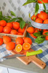 Freshly squeezed mandarin orange juice with glass pitcher, glass jars and aluminum reusable straws.