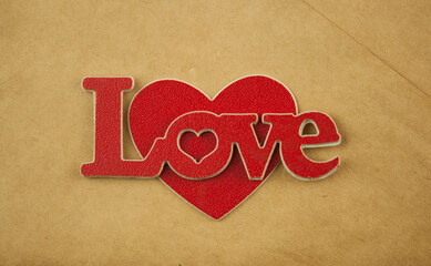 Red words love on brown background