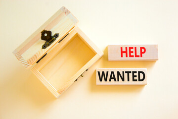 Help wanted and support symbol. Concept words Help wanted on wooden blocks on a beautiful white table white background. Empthy wooden chest. Business support and help wanted concept, copy space.