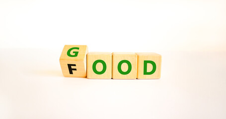Good food symbol. Turned wooden cubes and changed the word Food to Good. Beautiful white table white background. Lifestyle, healthy eating and good food concept, copy space.