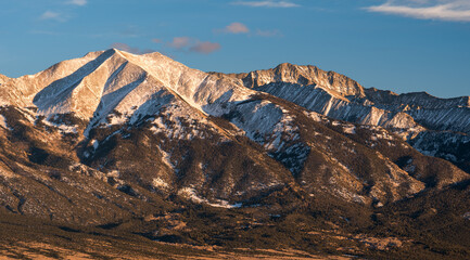 13,580 Foot Twin Peaks and 14,037 Foot Little Bear Mountain viewed from Highway Colorado 150, which...