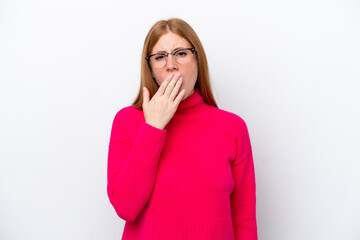 Young redhead woman isolated on white background yawning and covering wide open mouth with hand