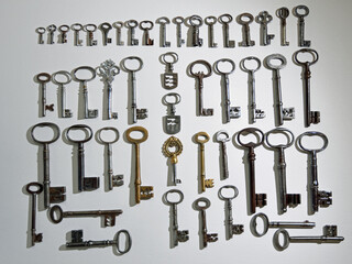 A Collection of 48 Antique Keys on white background