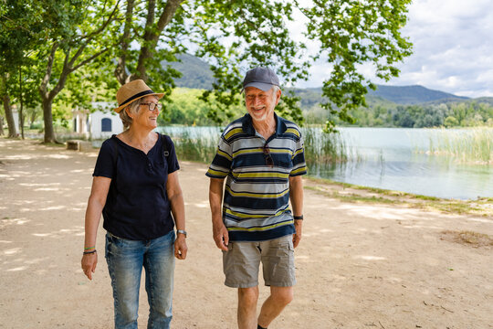 Senior couple hiking along the lake of Banyoles, Catalonia, Spain