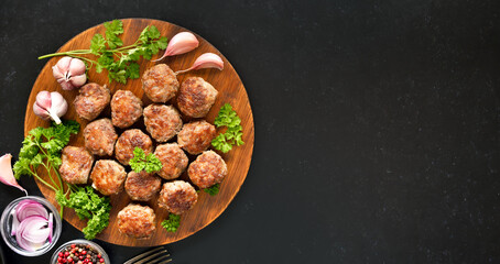 Fried meatballs on cutting board