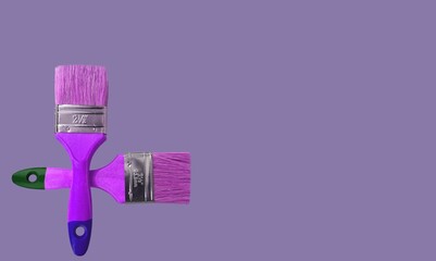 Paint brush of paint on trendy Very Peri background. Color of the year 2022.