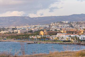 The city of Paphos in the setting sun from the coast. Late autumn in Cyprus.