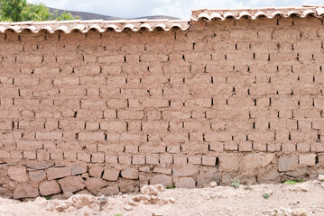 Wall of a house made entirely with mud bricks in Maras, Sacred Valley, Peru
