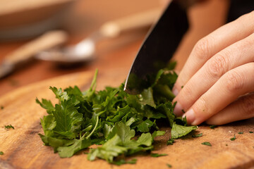 Parsley chopping on wooden board