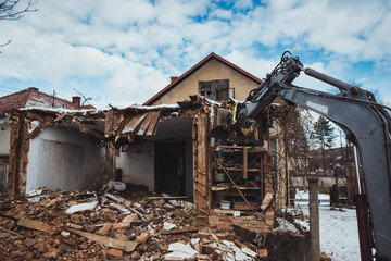 Fototapeta na wymiar Old house being demolished.