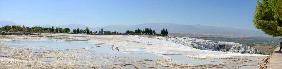 Panoramic view of travertine pools that are drying up in Pamukkale, Turkey.