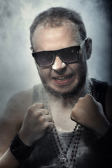 Brutal angry man covered by the dust