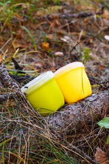 Camping utensils for picnic in the forest. Two mugs with lids for drinking tea and coffee on a hike. Camping cookware.