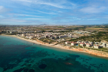 Fototapeta na wymiar Aerial view picturesque sandy beach of Mil Palmeras. Spain