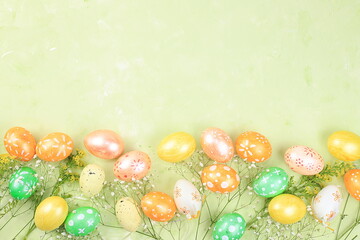 Fototapeta na wymiar Festive easter banner,spring composition with decorated homemade eggs and blooming flowers,creative concept of easter,ideas for home decorations,template for screen