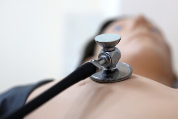 medical manikin for auscultation of the heart and lungs, manikin and stethoscope