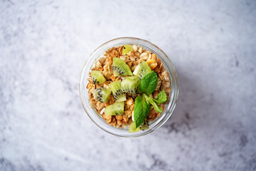 Kiwi Greek yogurt granola parfait in a glass