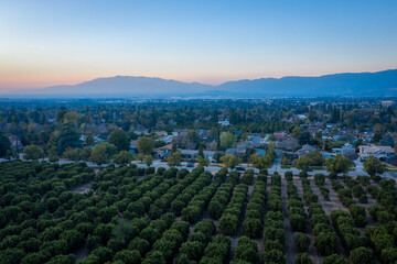 Aerial view over city at sunset