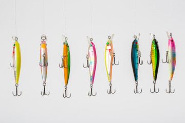 Fishing Lure (Wobbler) fishing temptations on white background. Many Fishing Spinning, fake bait,...