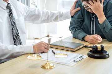 Male lawyer counselor are meeting with client to discuss consultation with litigation contract...