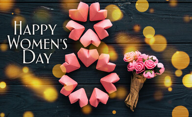 paper hearts shape figure eight 8 and flowers background.  happy International Women’s Day...