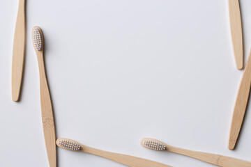 Set of ECO friendly wooden bamboo toothbrushes. Save the planet or NO plastic concept. Isolated on white background.
