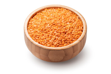 Red lentils in wooden bowl isolated on white background.