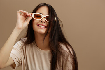 beautiful woman attractive look charmin dark glasses in a t-shirt isolated background