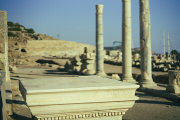 Stone podium natural with background of antique ruins of greece town. Rock pedestal for product...