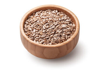 Raw sunflower seeds in wooden bowl isolated on white background