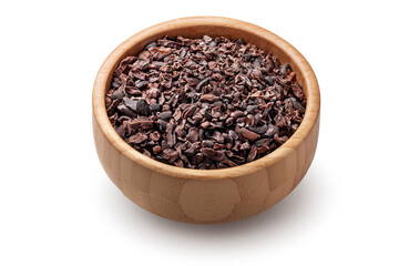Raw organic cacao nibs in wooden bowl isolated on white background