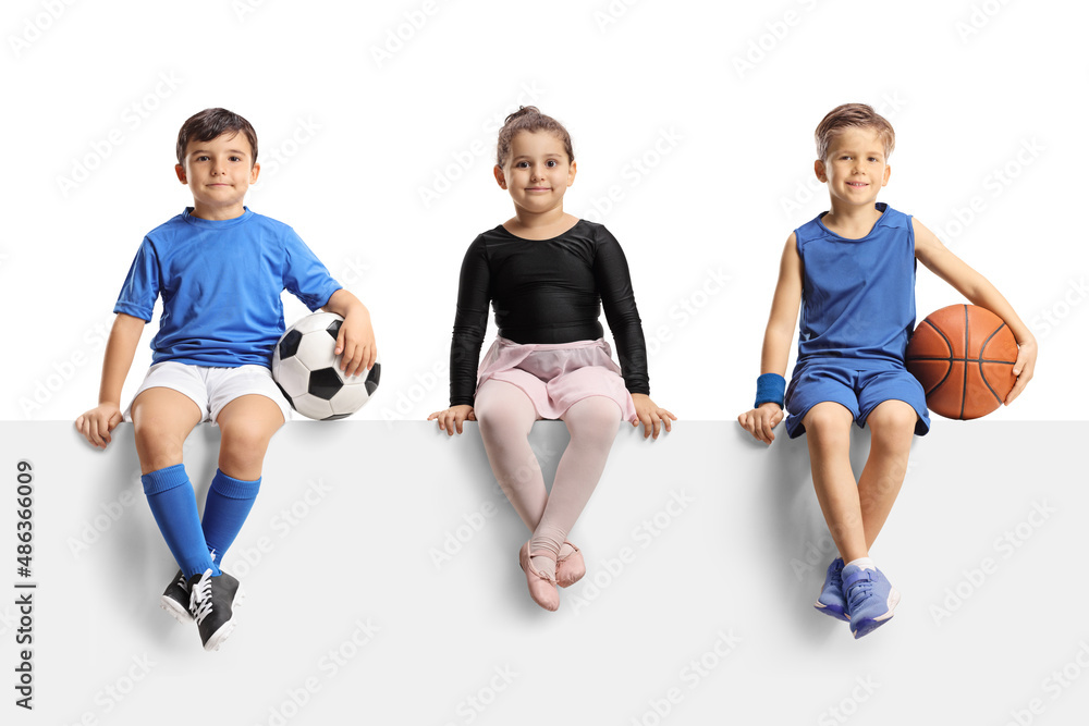 Canvas Prints Ballerina girl, boys with football and basketball sitting on a blank panel