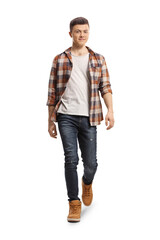 Full length portrait of a guy in jeans and checkered shirt walking towards camera - obrazy, fototapety, plakaty