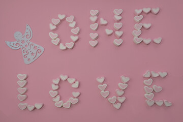 words I love surrounded by angels. From white and pink marshmallow hearts on a pale pink background. Sweet declaration of love for lovers. Airy sweets of various shapes. Card
February 14, Valentine's 