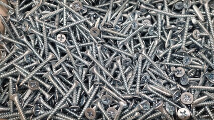 Abstract background in the form of screws and hardware. 