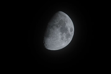  close up of the waxing crescent moon in the black night sky