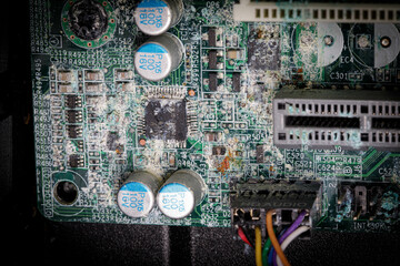 a mainboard of a computer is corroded due to water penetration