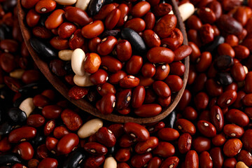 Dried red beans and black, white mix on rustic table
