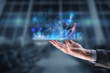 Businessman hand holding tablet showing graph economic growth target success. Plan business growth in year 2022 concept.