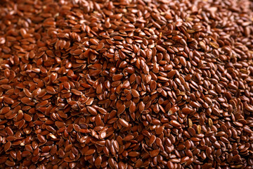 Organic Flax seeds on rustic table. Vegan food.