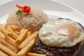 The traditional Brazilian dish. horse steak (filet with egg served with rice and fries)